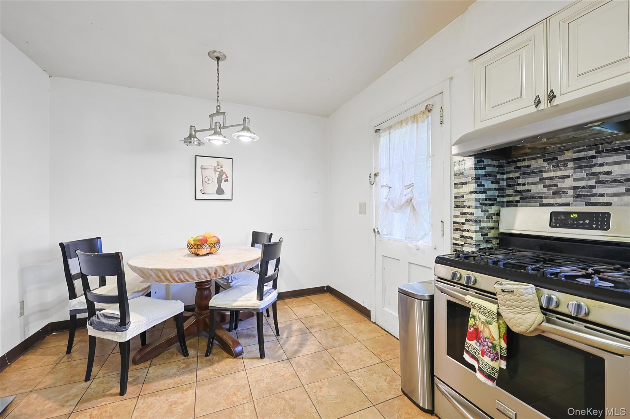 84 Middle Neck Road Roslyn, NY 11576 - Photo 14 of 44 a kitchen with stainless steel appliances kitchen island granite countertop a sink and a stove