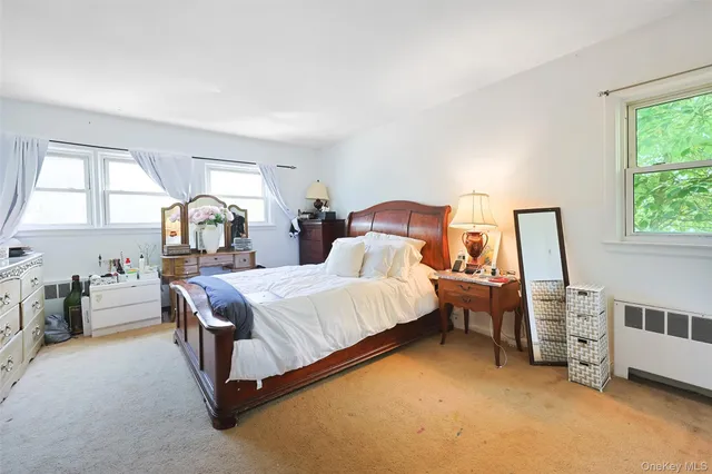 a bed room with bed and window