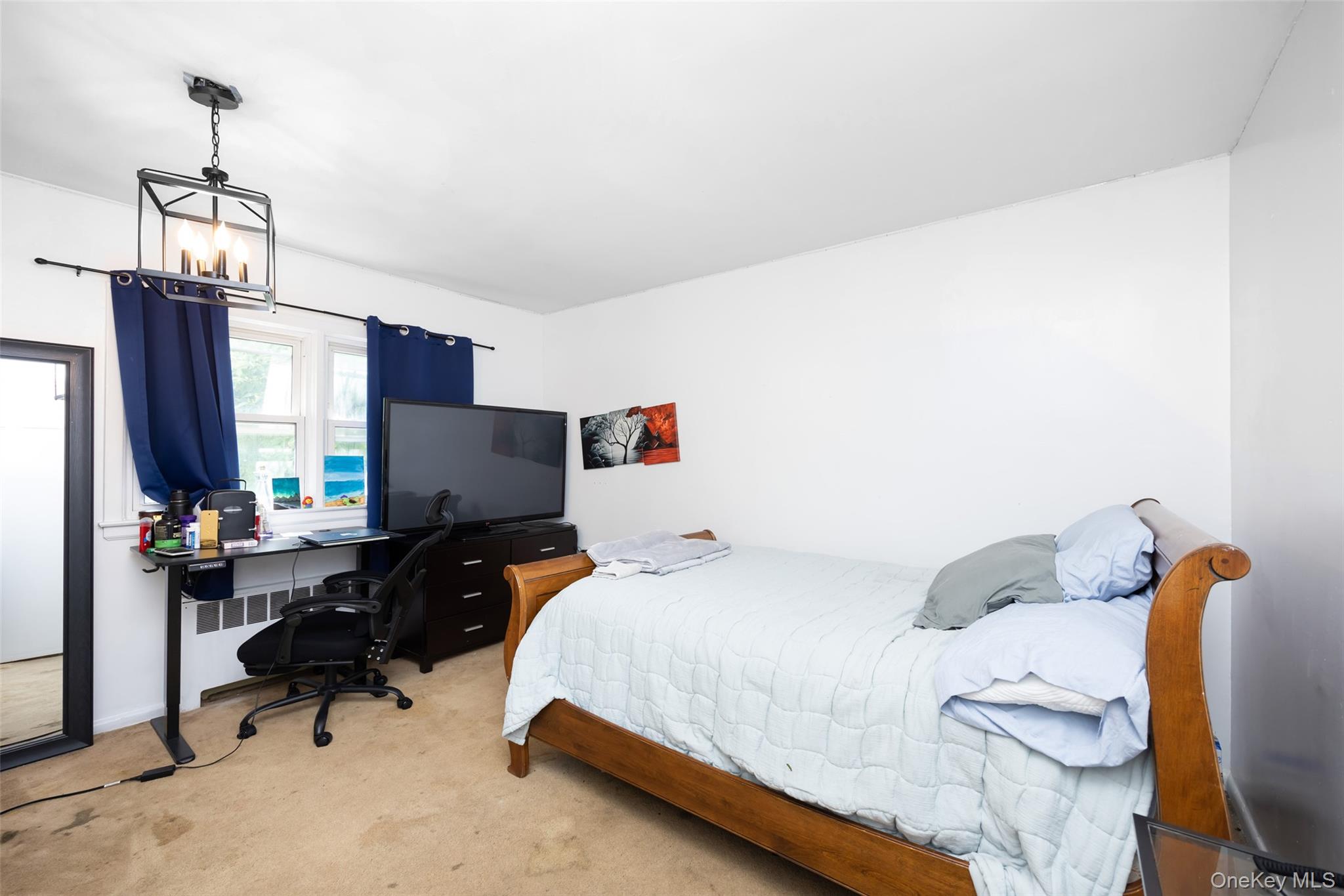 84 Middle Neck Road Roslyn, NY 11576 - Photo 24 of 44 a bedroom with a bed and a desk