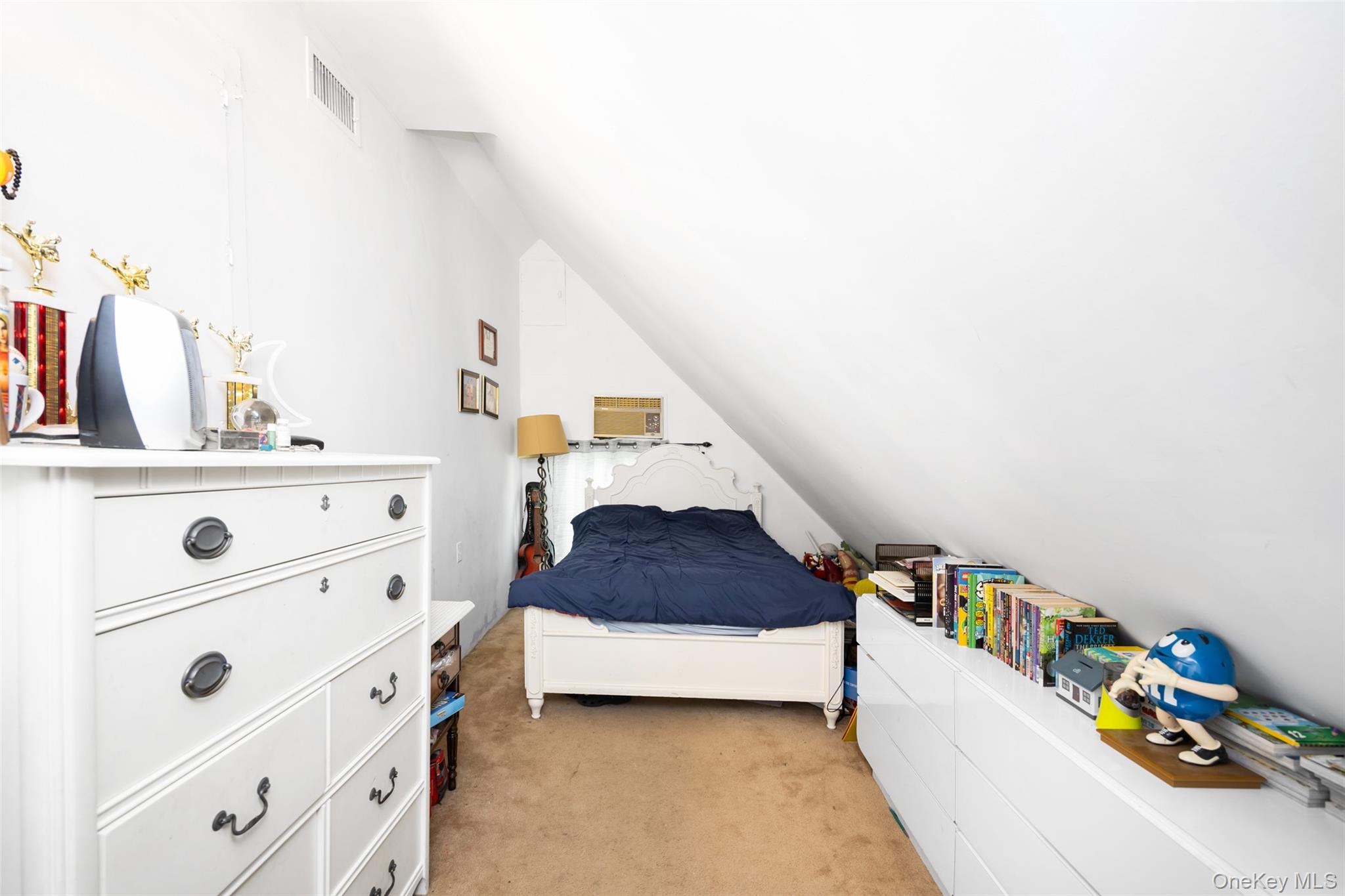 84 Middle Neck Road Roslyn, NY 11576 - Photo 25 of 44 a bedroom with a bed and a cabinets