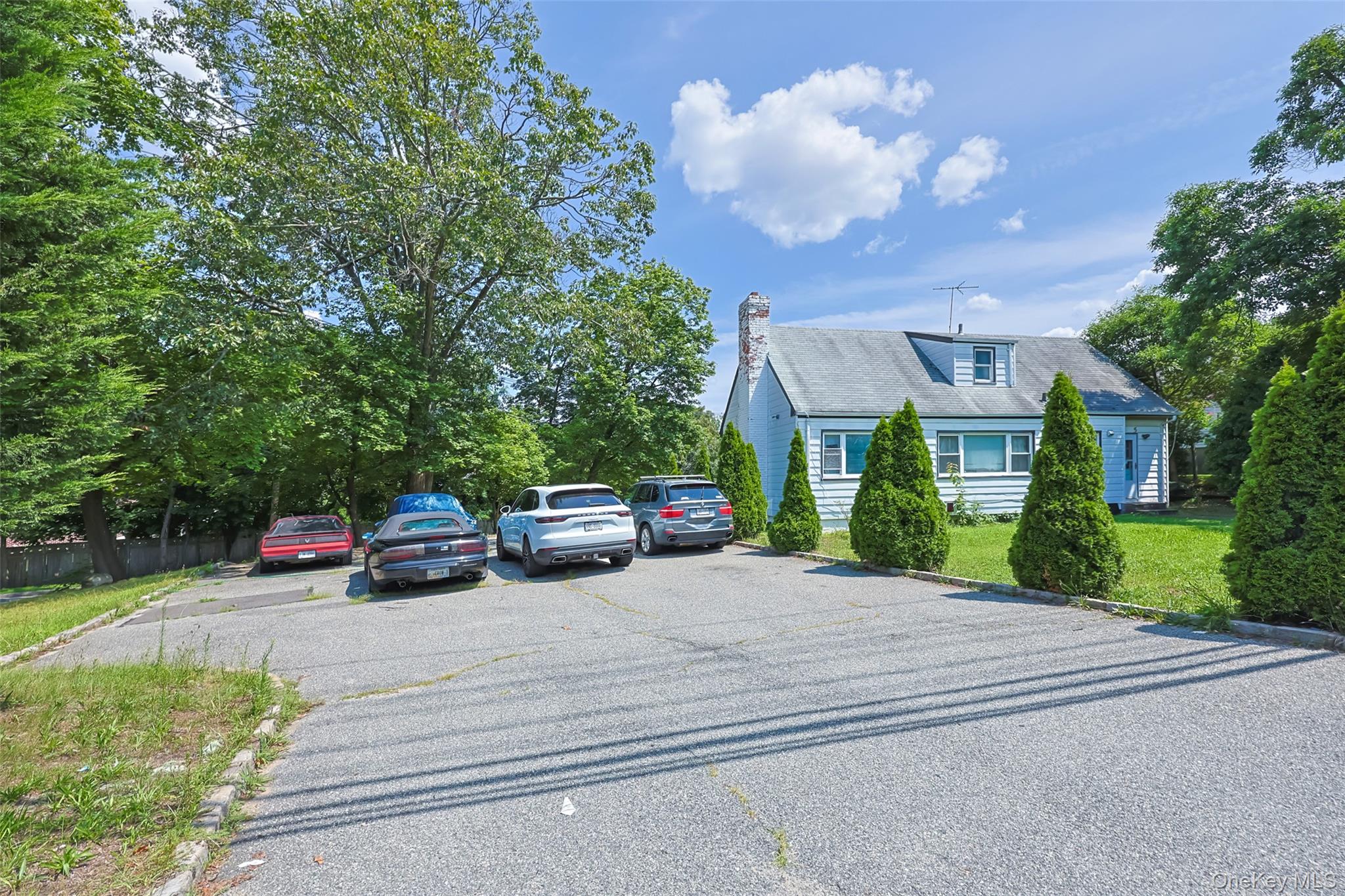 84 Middle Neck Road Roslyn, NY 11576 - Photo 3 of 44 a view of a car park in front of a house