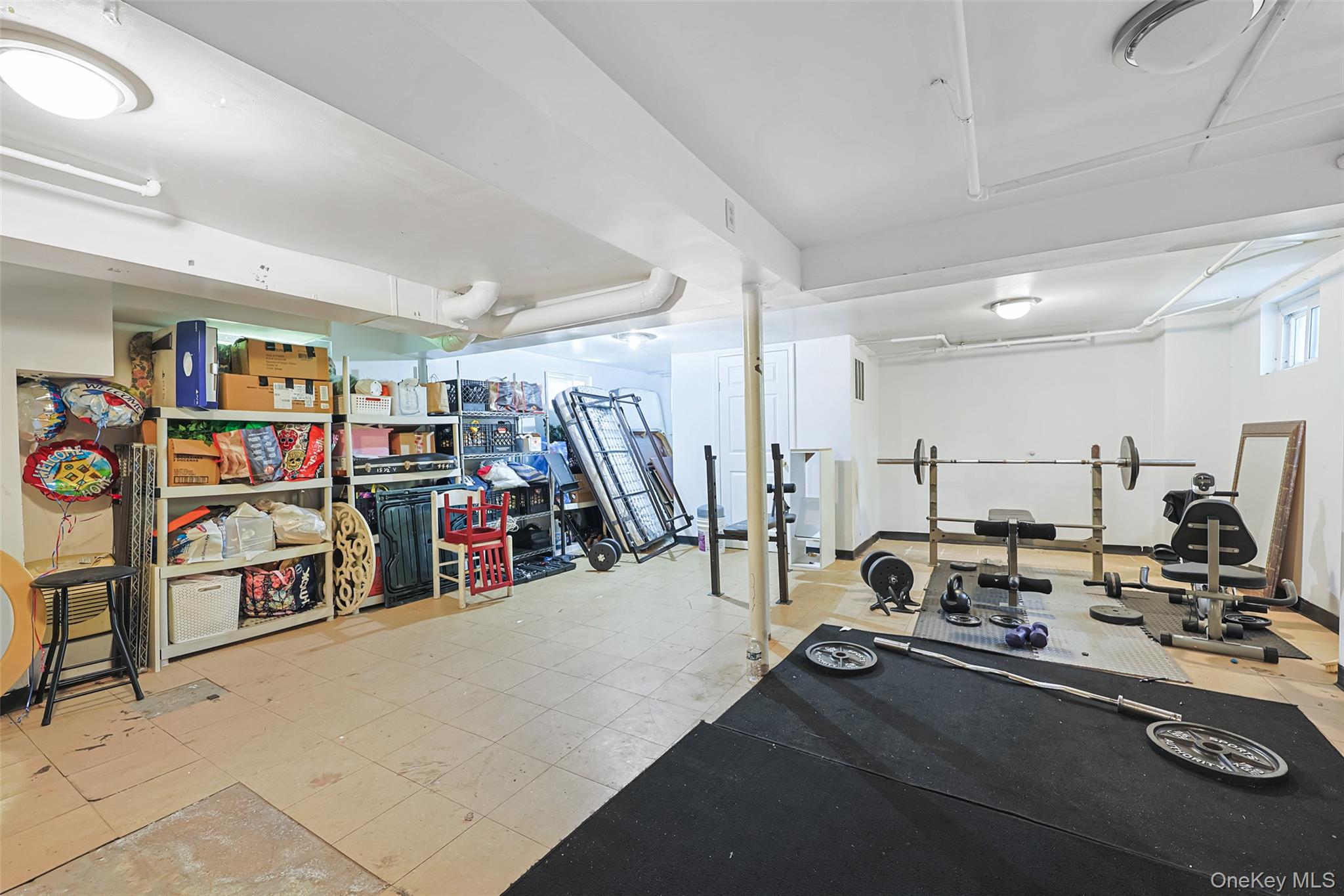 84 Middle Neck Road Roslyn, NY 11576 - Photo 31 of 44 a view of a room with gym equipment