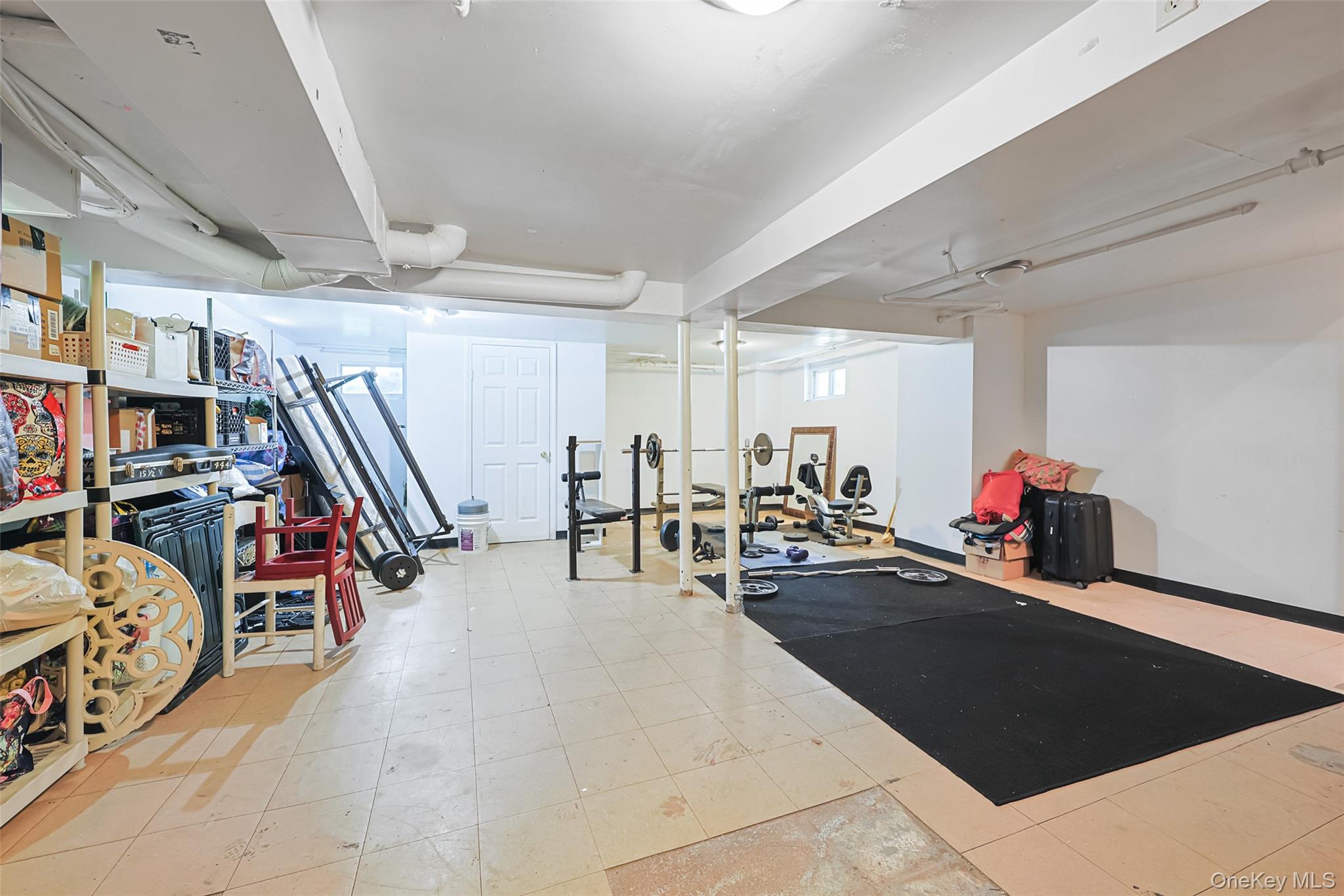 84 Middle Neck Road Roslyn, NY 11576 - Photo 33 of 44 a view of a room with gym equipment