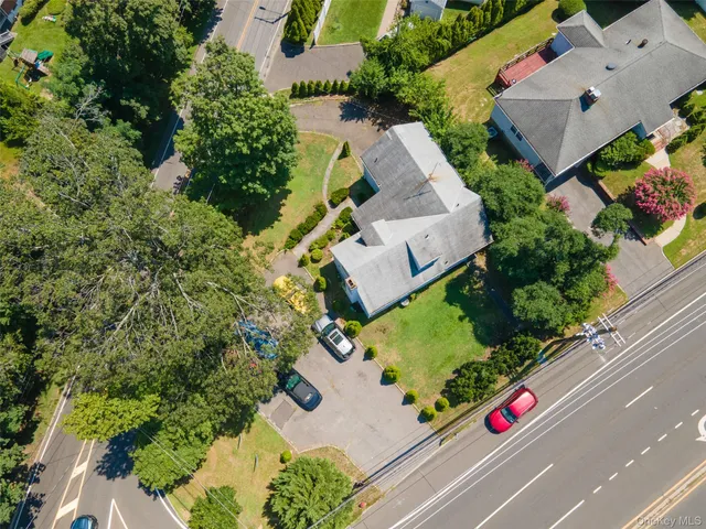 an aerial view of house with yard