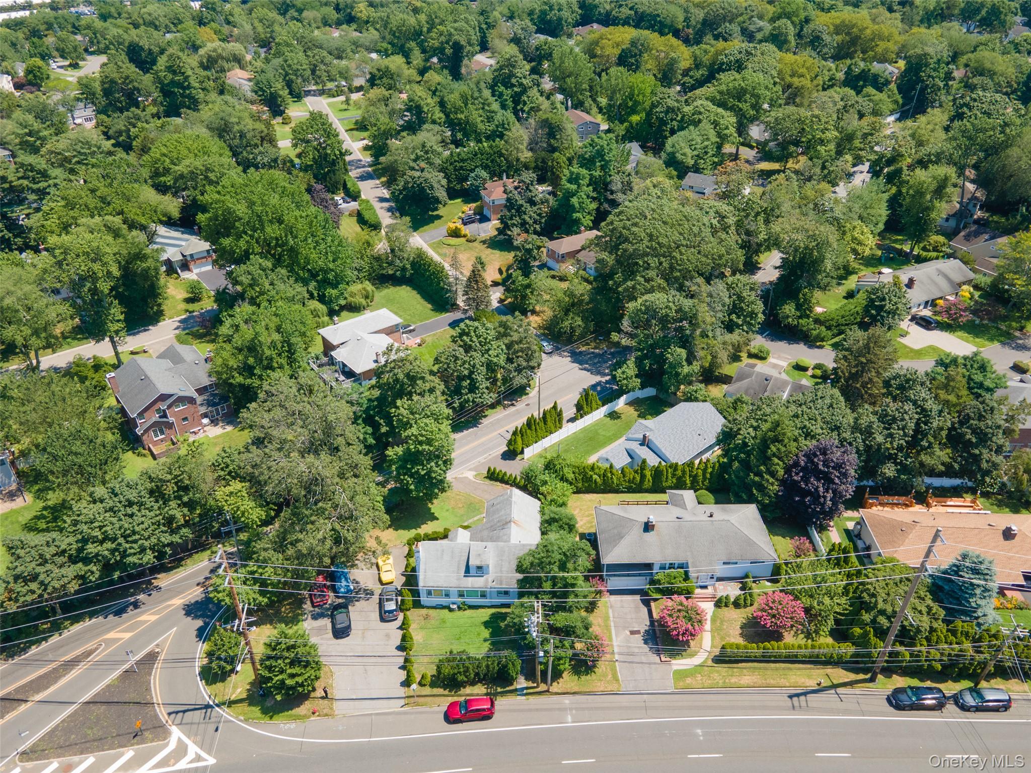 84 Middle Neck Road Roslyn, NY 11576 - Photo 38 of 44 an aerial view of houses with yard