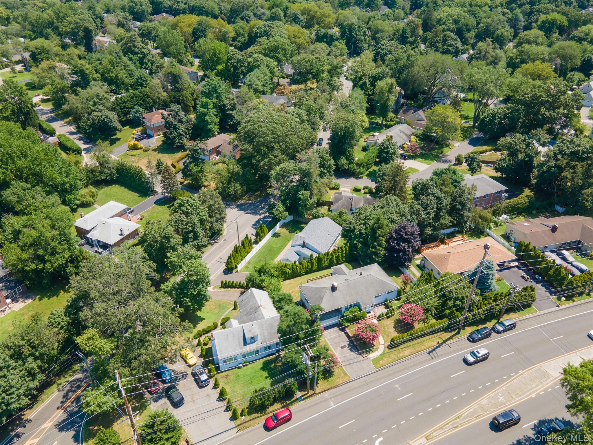 84 Middle Neck Road Roslyn, NY 11576 - Photo 39 of 44 an aerial view of a house with a garden