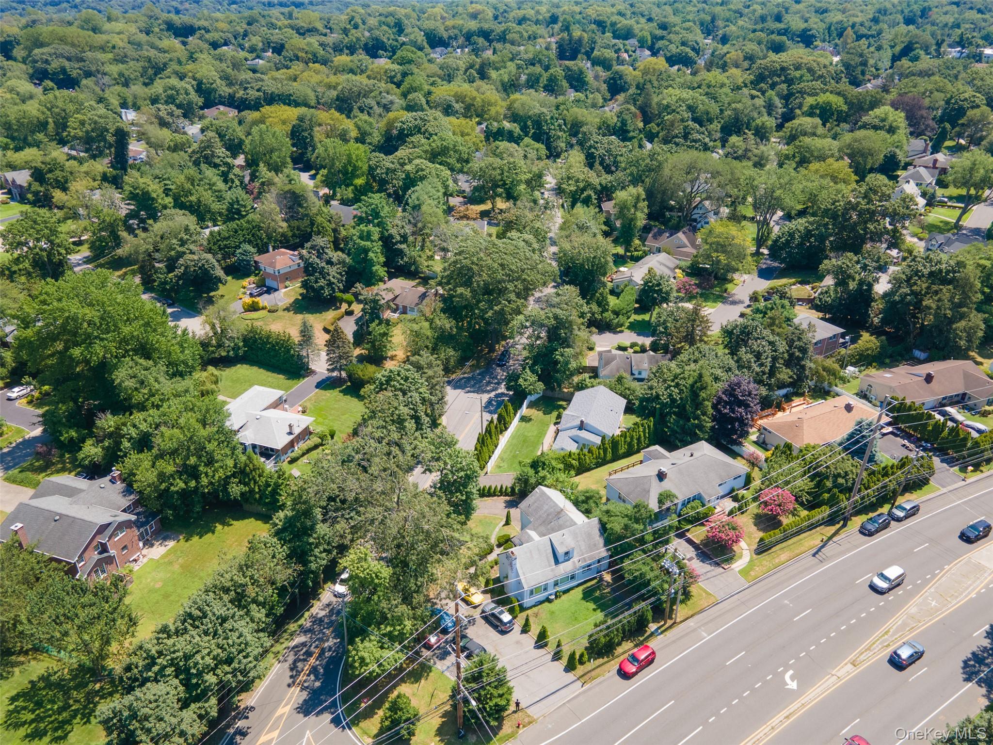 84 Middle Neck Road Roslyn, NY 11576 - Photo 40 of 44 an aerial view of a city with lots of residential buildings