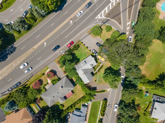 an aerial view of a house with a yard and garden