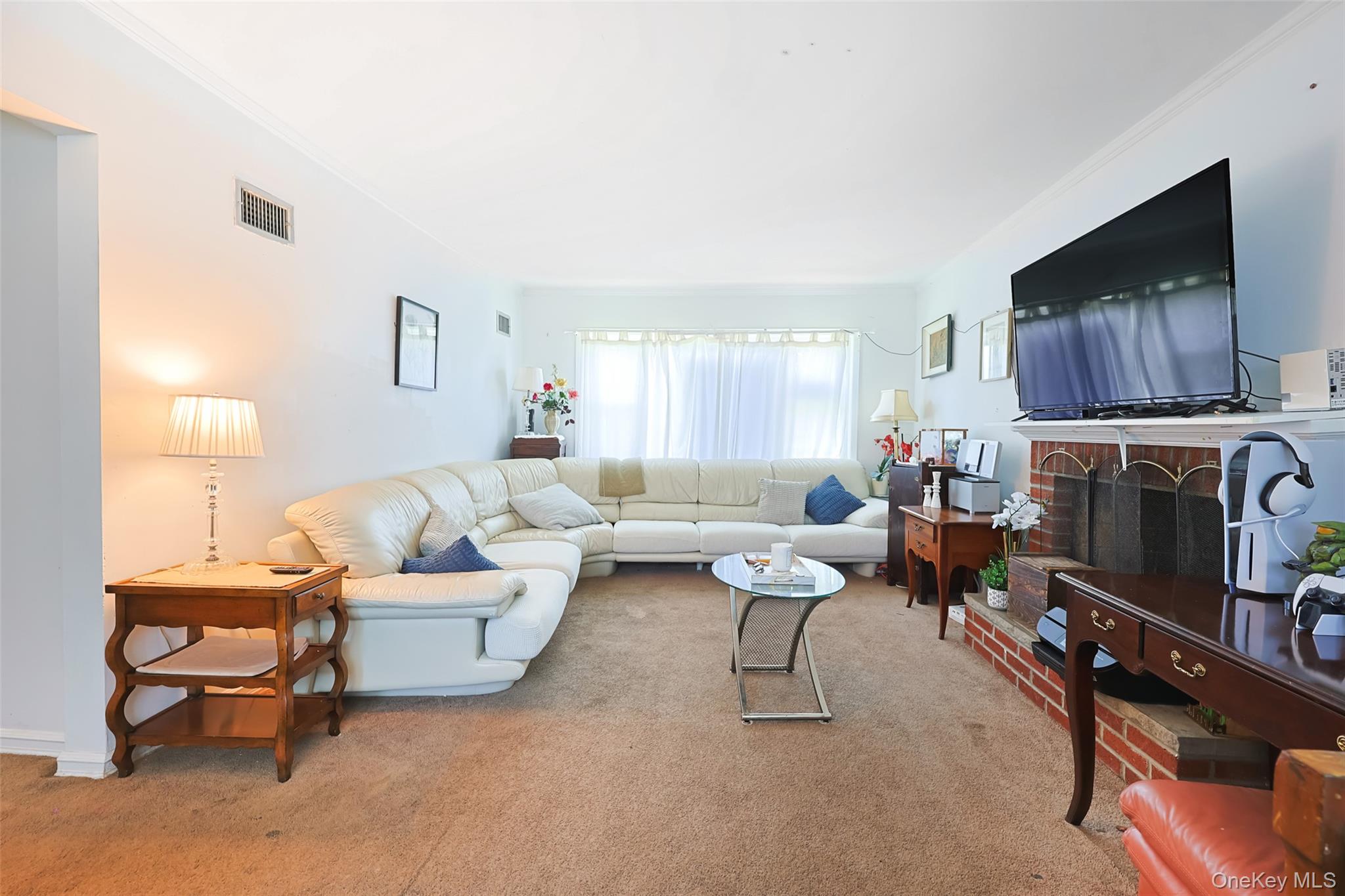 84 Middle Neck Road Roslyn, NY 11576 - Photo 8 of 44 a living room with furniture a flat screen tv and a fireplace