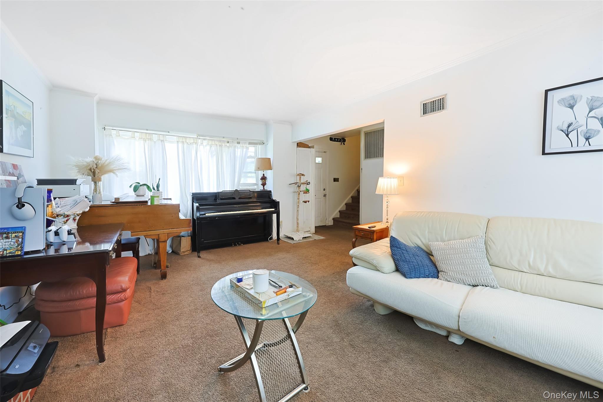 84 Middle Neck Road Roslyn, NY 11576 - Photo 9 of 44 a living room with furniture and a dining table
