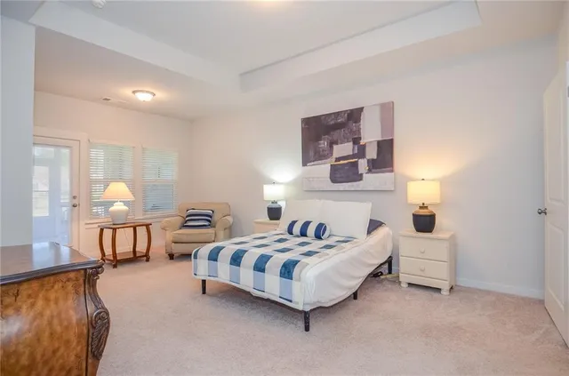 a bedroom with bed and a couch