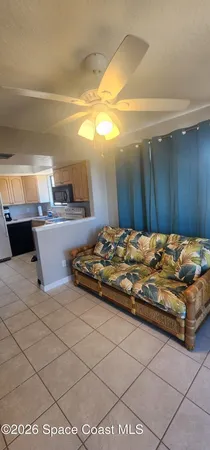 a kitchen with kitchen island granite countertop a sink cabinets and window