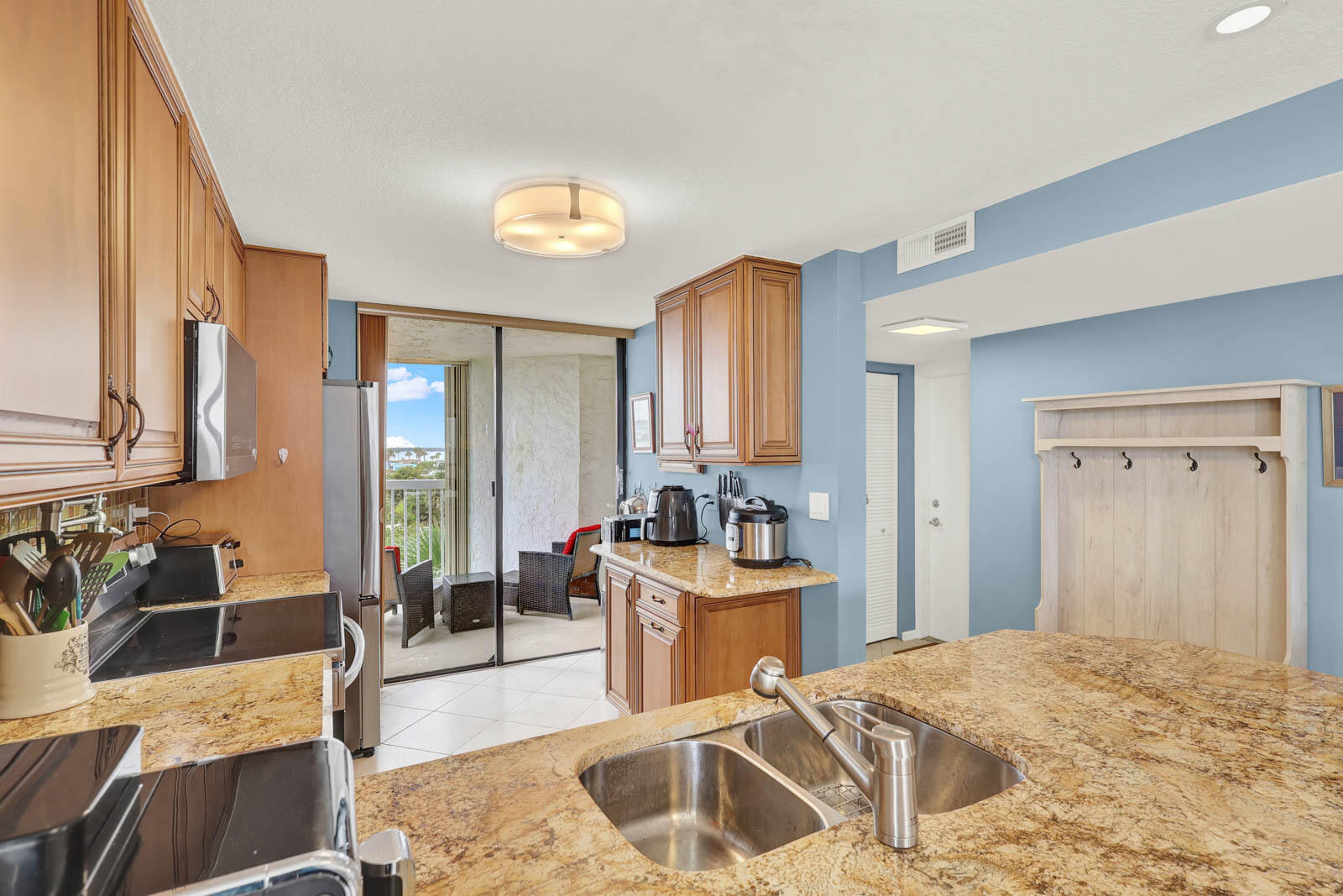 10600 South Ocean Drive, Unit 310 Jensen Beach, FL 34957 - Photo 12 of 45 a bedroom with a bed and a couch