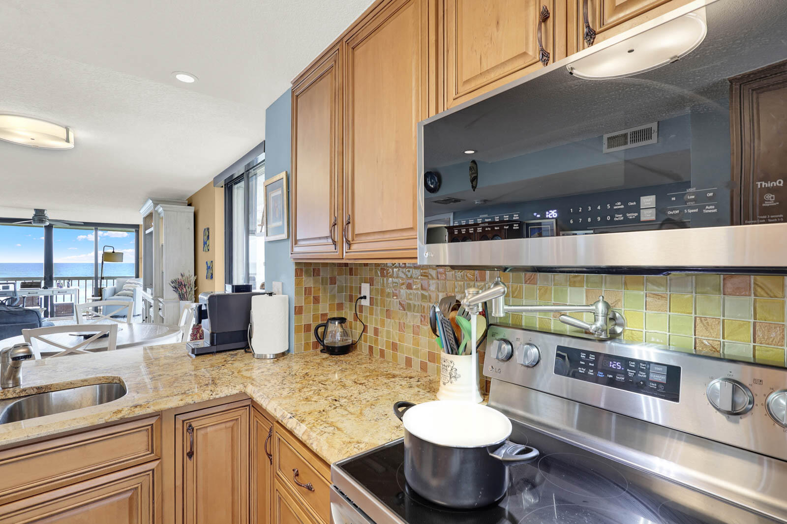 10600 South Ocean Drive, Unit 310 Jensen Beach, FL 34957 - Photo 13 of 45 a kitchen with a sink and a stove top oven