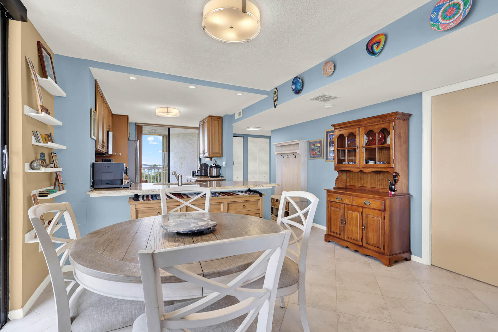 10600 South Ocean Drive, Unit 310 Jensen Beach, FL 34957 - Photo 18 of 45 a dining room with furniture and wooden floor