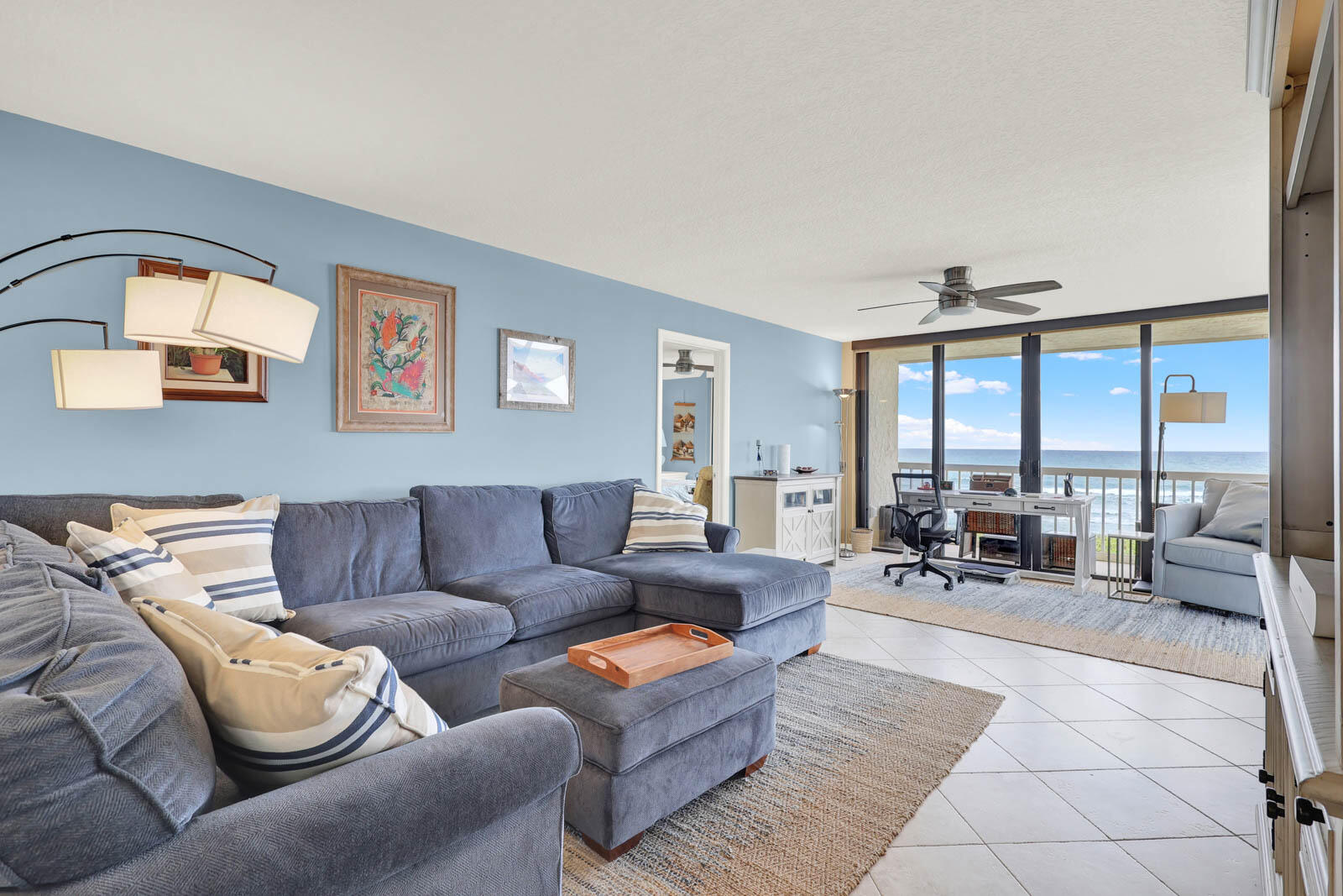 10600 South Ocean Drive, Unit 310 Jensen Beach, FL 34957 - Photo 20 of 45 a living room with furniture and large windows