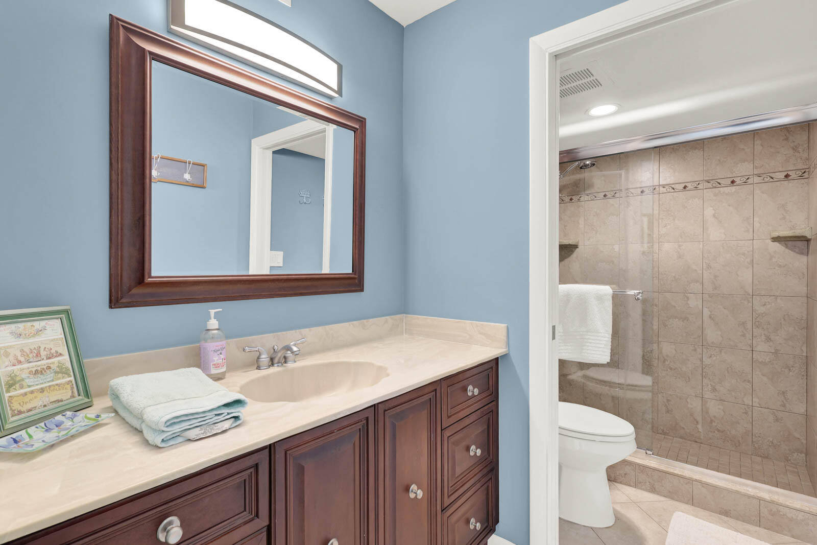 10600 South Ocean Drive, Unit 310 Jensen Beach, FL 34957 - Photo 25 of 45 a bathroom with a granite countertop sink toilet and shower