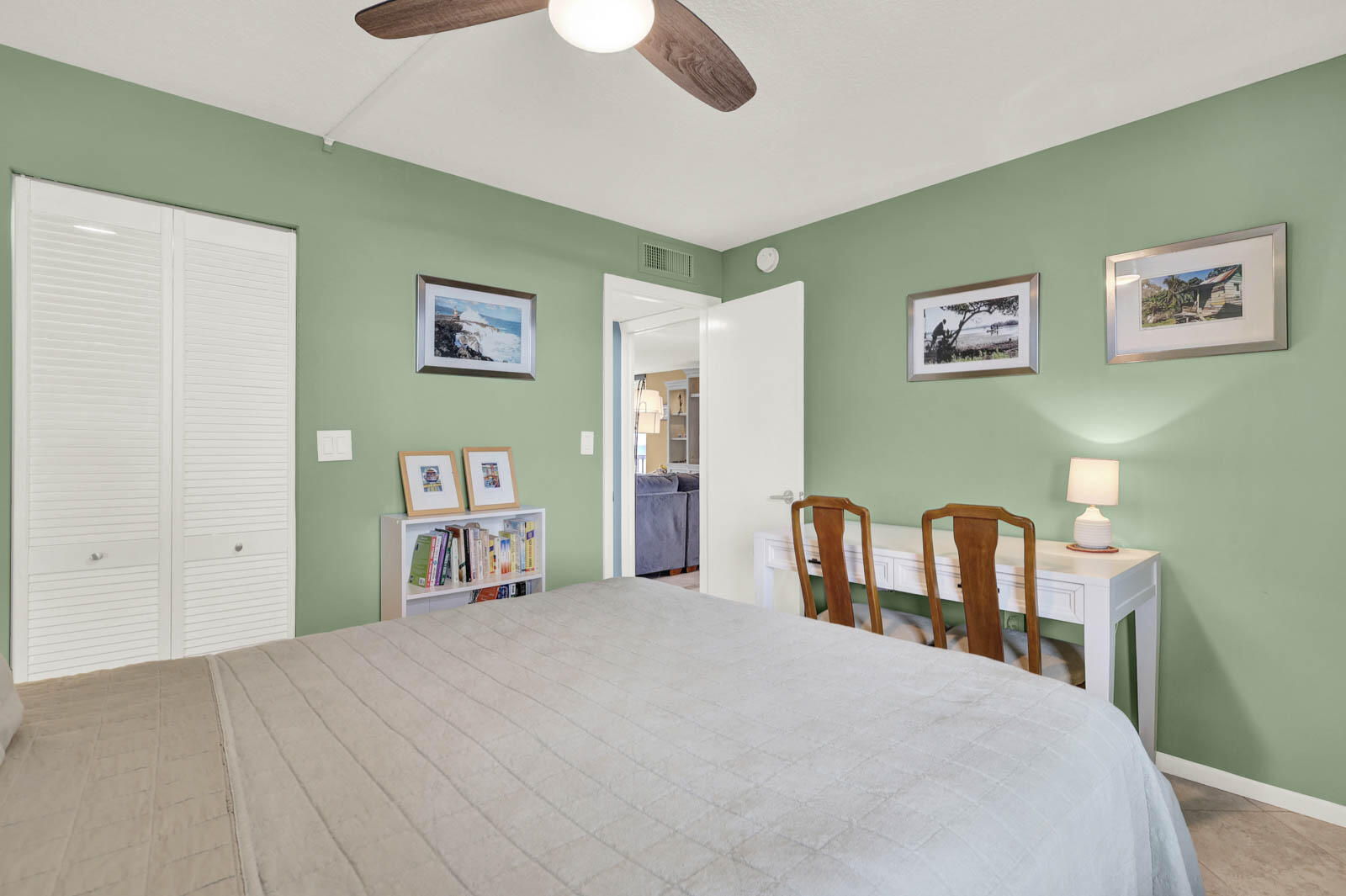 10600 South Ocean Drive, Unit 310 Jensen Beach, FL 34957 - Photo 26 of 45 a bedroom with a bed and a chair