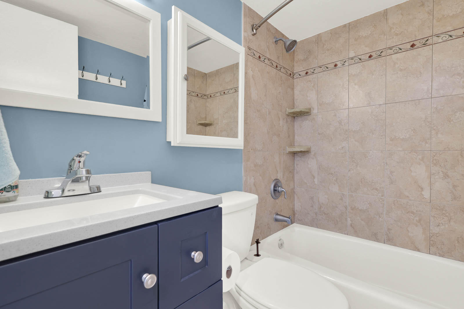 10600 South Ocean Drive, Unit 310 Jensen Beach, FL 34957 - Photo 28 of 45 a bathroom with a sink toilet and shower