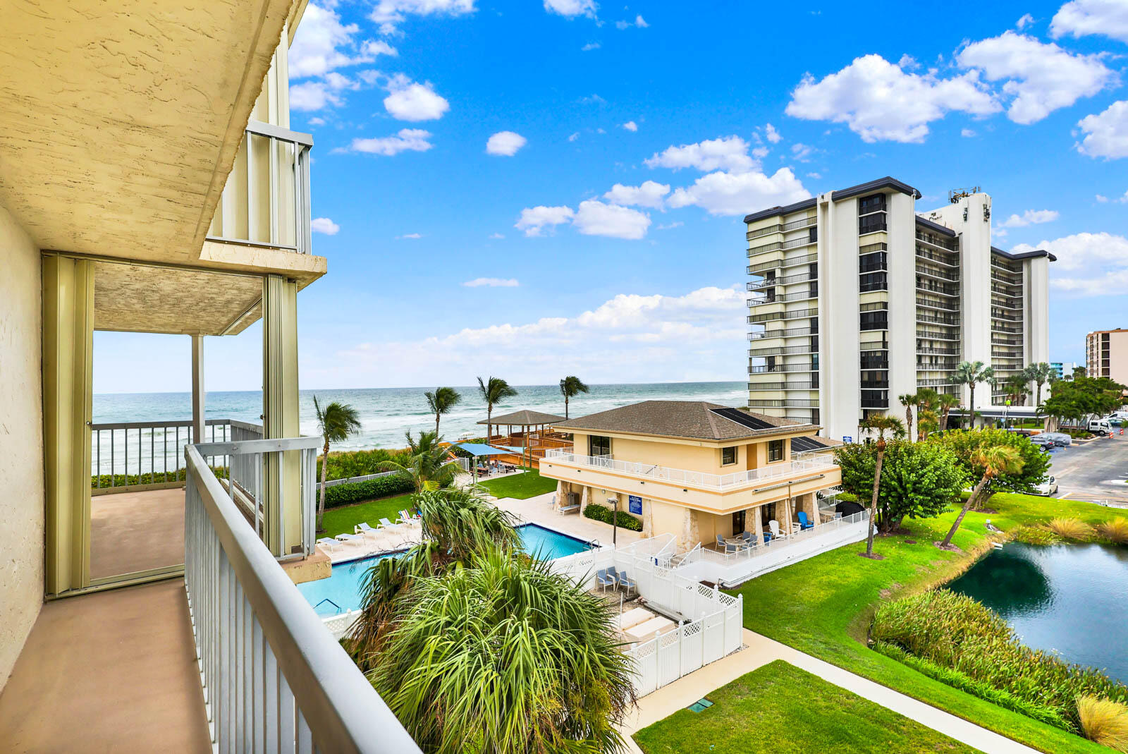 10600 South Ocean Drive, Unit 310 Jensen Beach, FL 34957 - Photo 33 of 45 a terrace with outdoor seating and city view