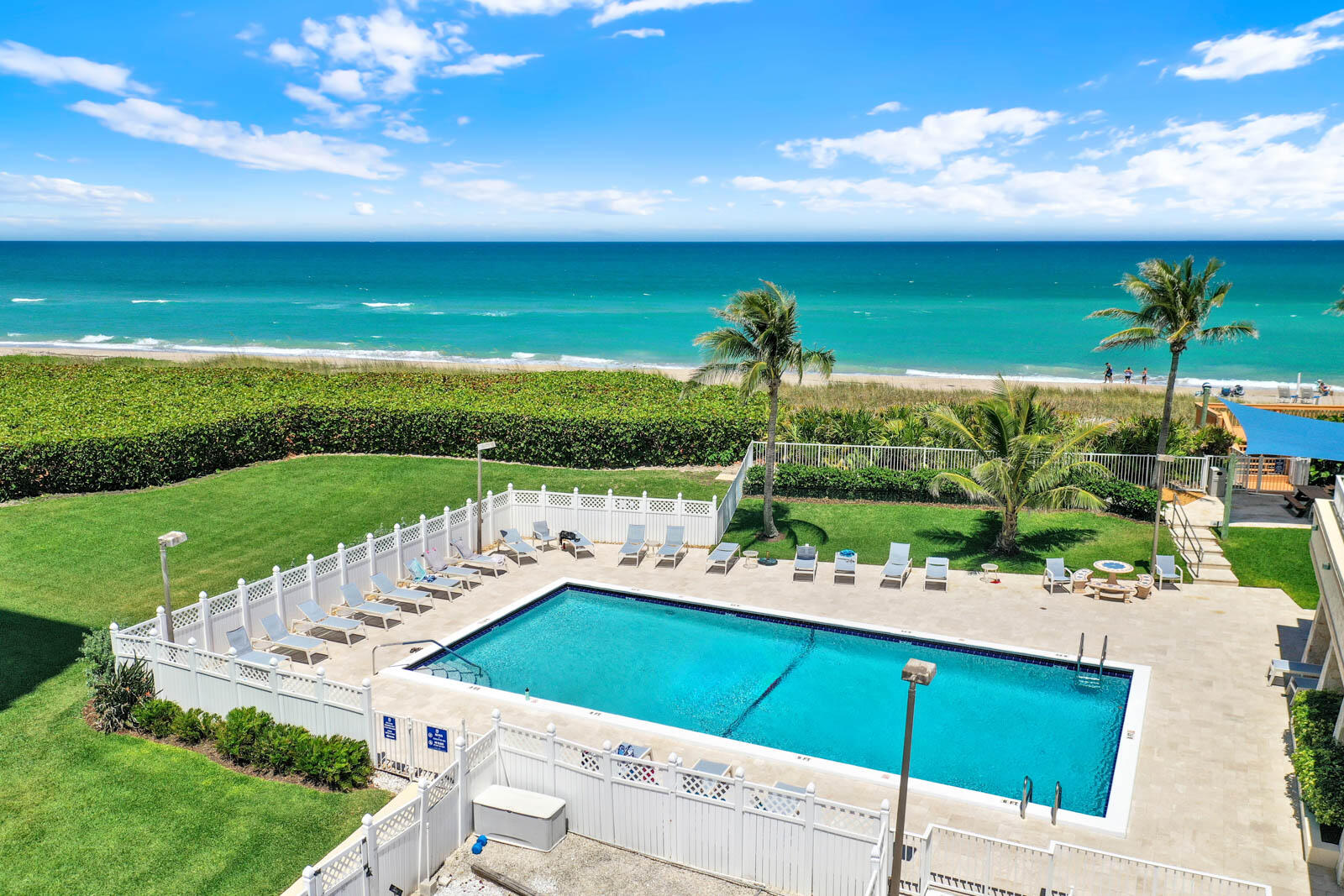 10600 South Ocean Drive, Unit 310 Jensen Beach, FL 34957 - Photo 35 of 45 a view of a terrace with a garden and deck