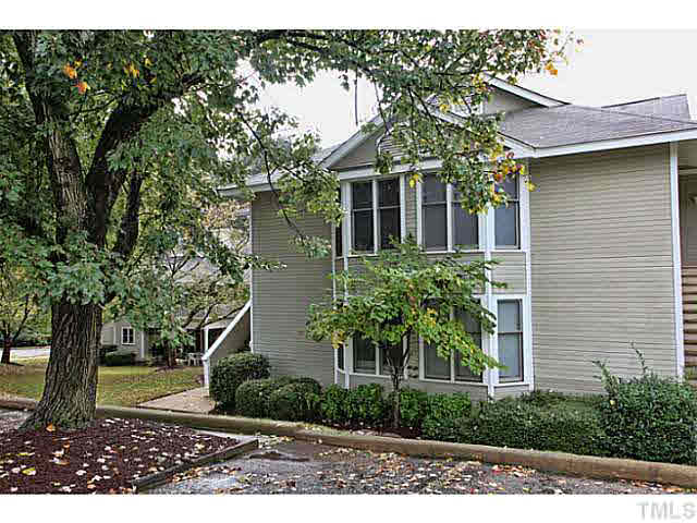 2821 Edridge Court, Unit 101 Raleigh, NC 27612 - Photo 1 of 25 a view of a house with a tree in front
