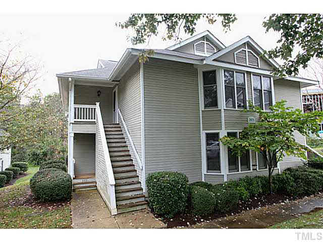 2821 Edridge Court, Unit 101 Raleigh, NC 27612 - Photo 2 of 25 a front view of a house with a garden