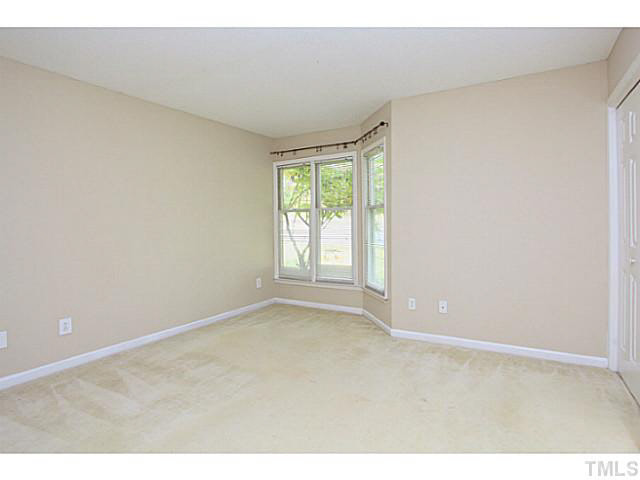 2821 Edridge Court, Unit 101 Raleigh, NC 27612 - Photo 14 of 25 a view of an empty room with a window