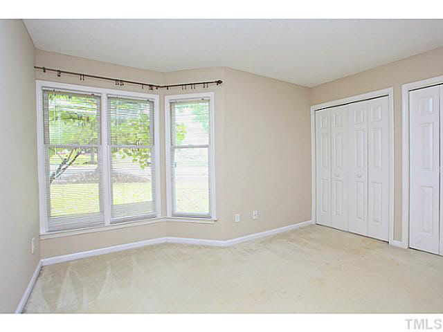 2821 Edridge Court, Unit 101 Raleigh, NC 27612 - Photo 15 of 25 a view of an empty room with a window