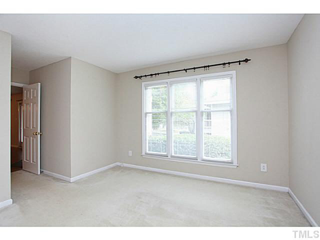 2821 Edridge Court, Unit 101 Raleigh, NC 27612 - Photo 16 of 25 a big room with windows and closet