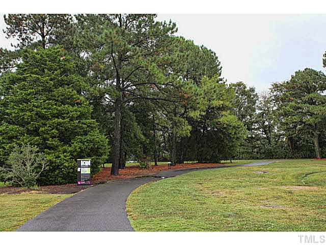 2821 Edridge Court, Unit 101 Raleigh, NC 27612 - Photo 21 of 25 a view of a green field with trees