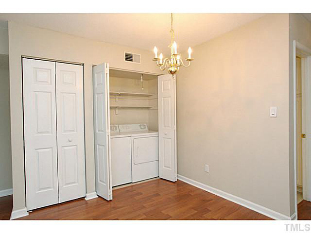 2821 Edridge Court, Unit 101 Raleigh, NC 27612 - Photo 8 of 25 a view of a chandelier in a room