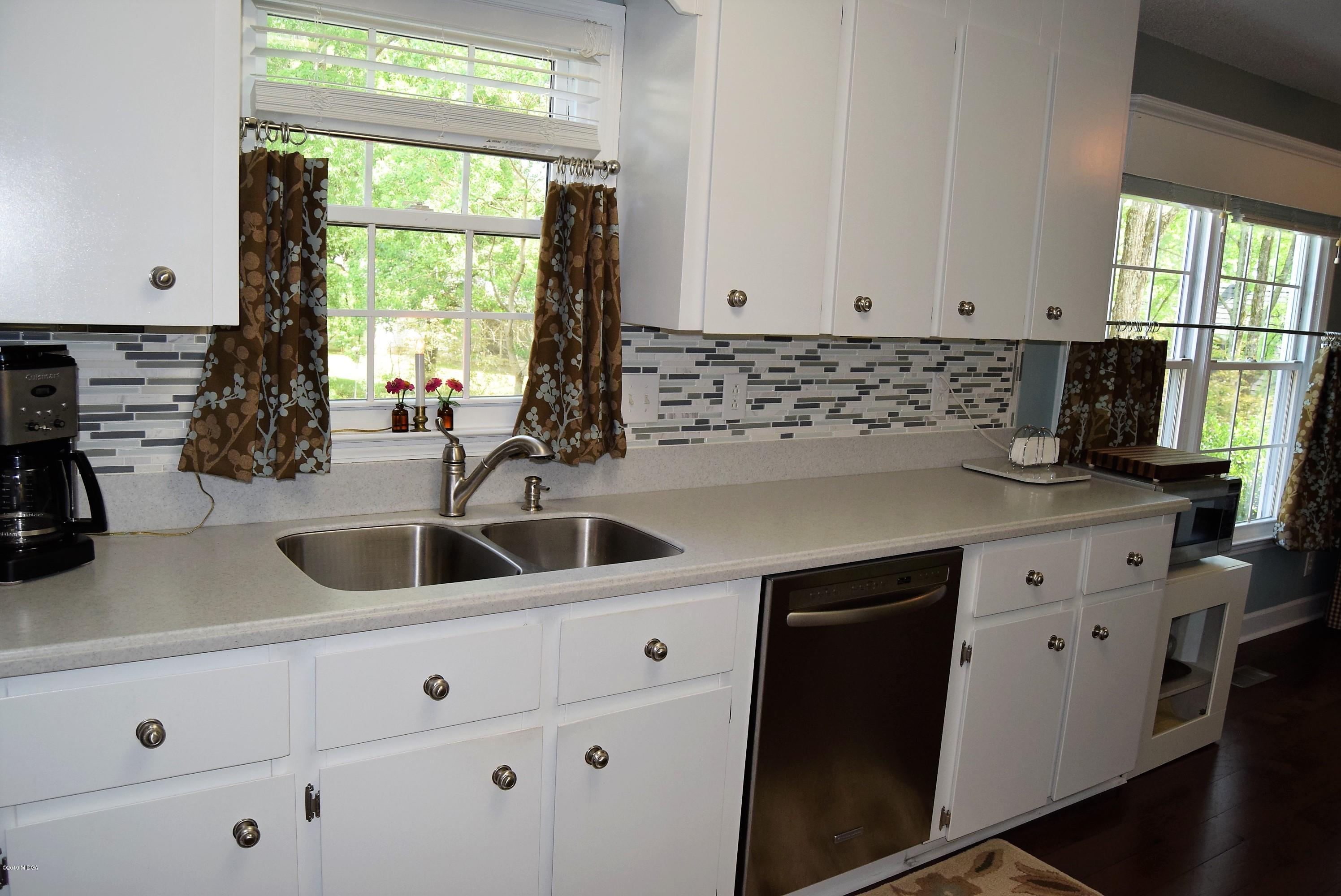 475 Stone Edge Road Macon, GA 31210 - Photo 11 of 36 a kitchen with sink a window and cabinets