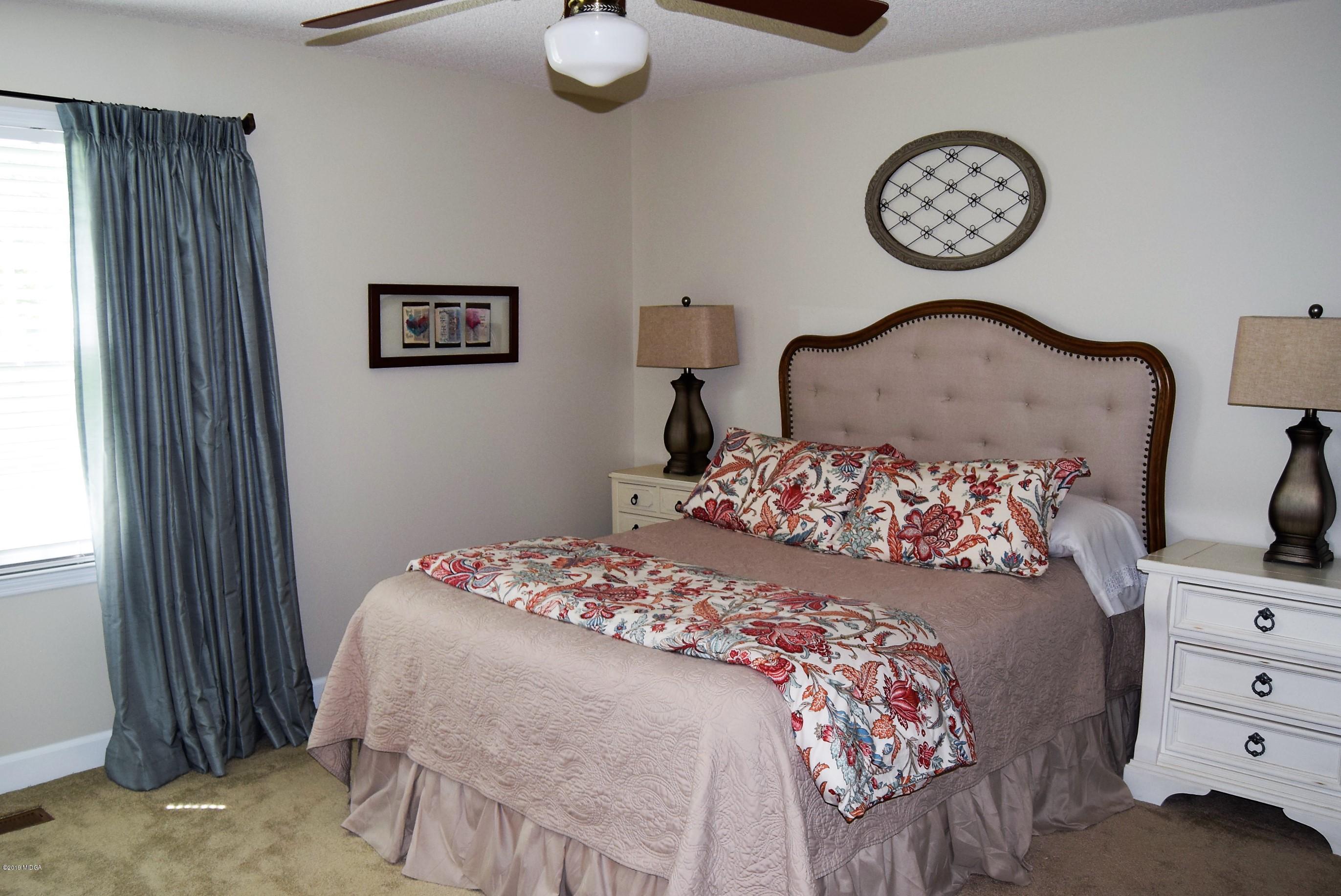 475 Stone Edge Road Macon, GA 31210 - Photo 16 of 36 a bedroom with a bed and a dresser