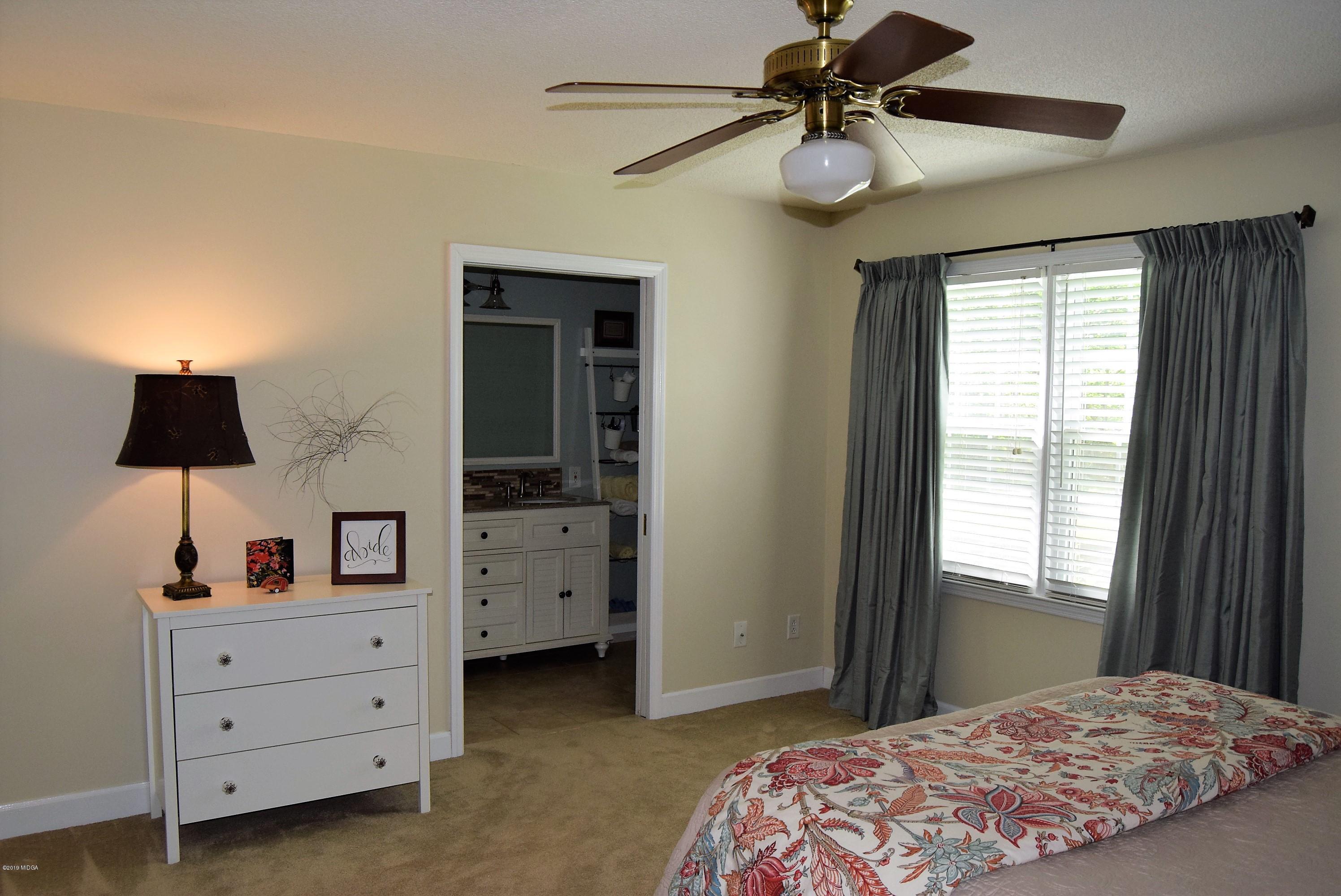 475 Stone Edge Road Macon, GA 31210 - Photo 17 of 36 a bedroom with a bed and a window