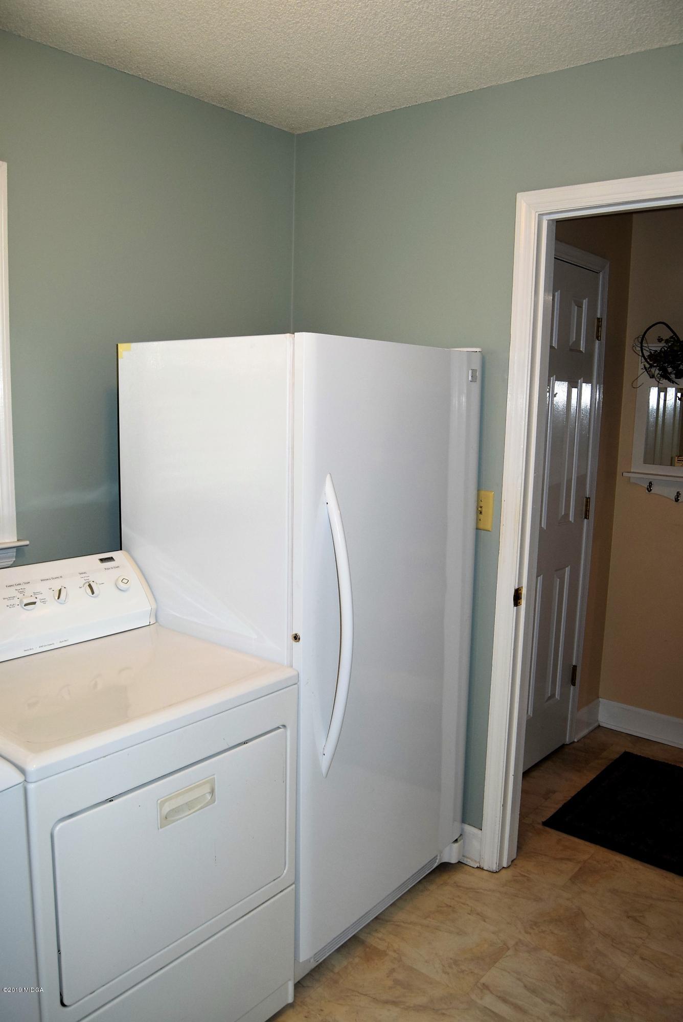 475 Stone Edge Road Macon, GA 31210 - Photo 27 of 36 a view of storage and utility room with washer and dryer