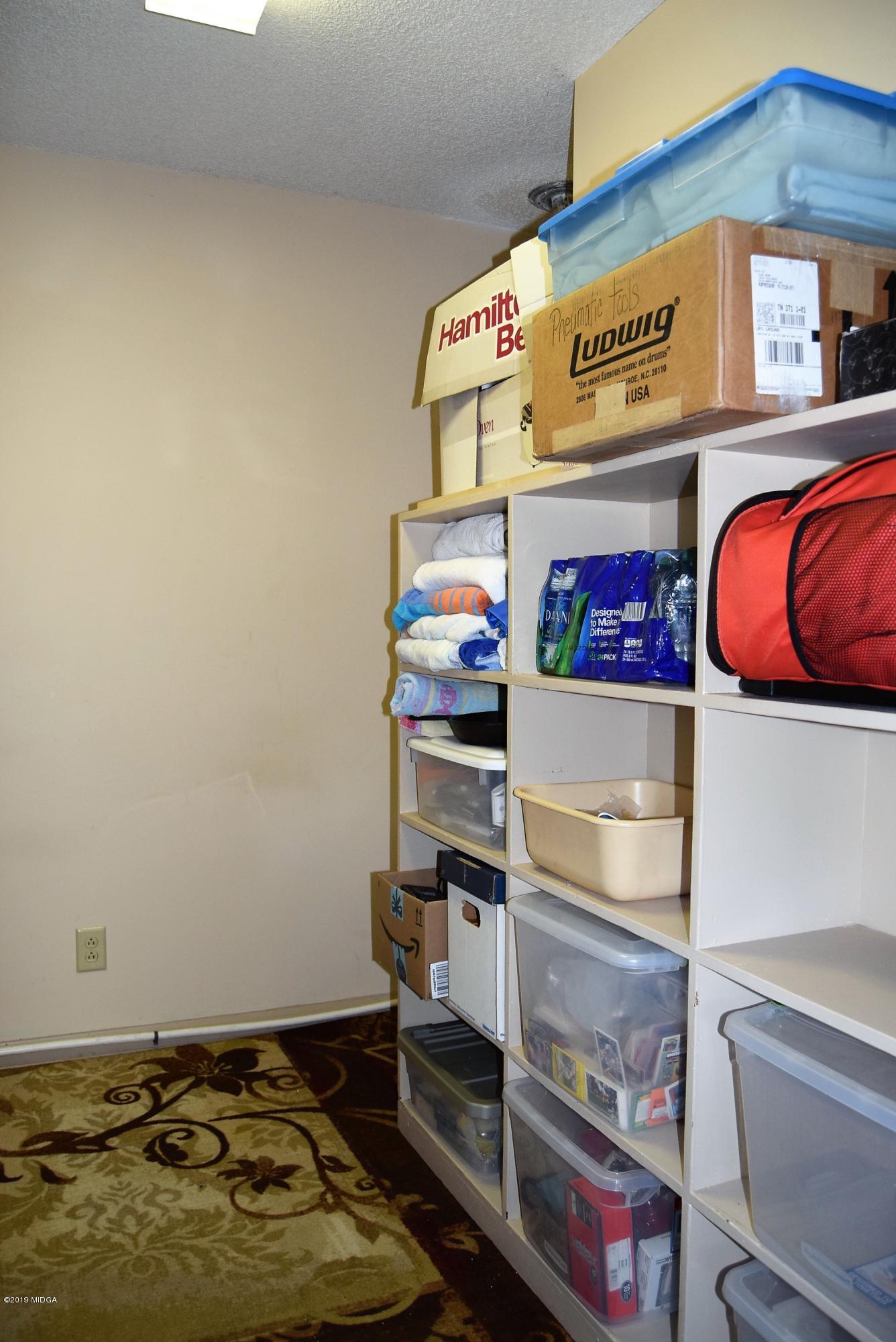 475 Stone Edge Road Macon, GA 31210 - Photo 28 of 36 a store room with stainless steel appliances and cabinets