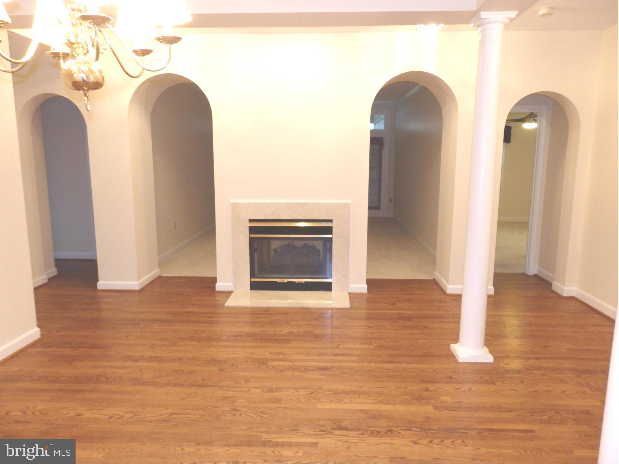 2419 Bear Den Road Frederick, MD 21701 - Photo 6 of 24 Dining and living rooms share two sided fireplace