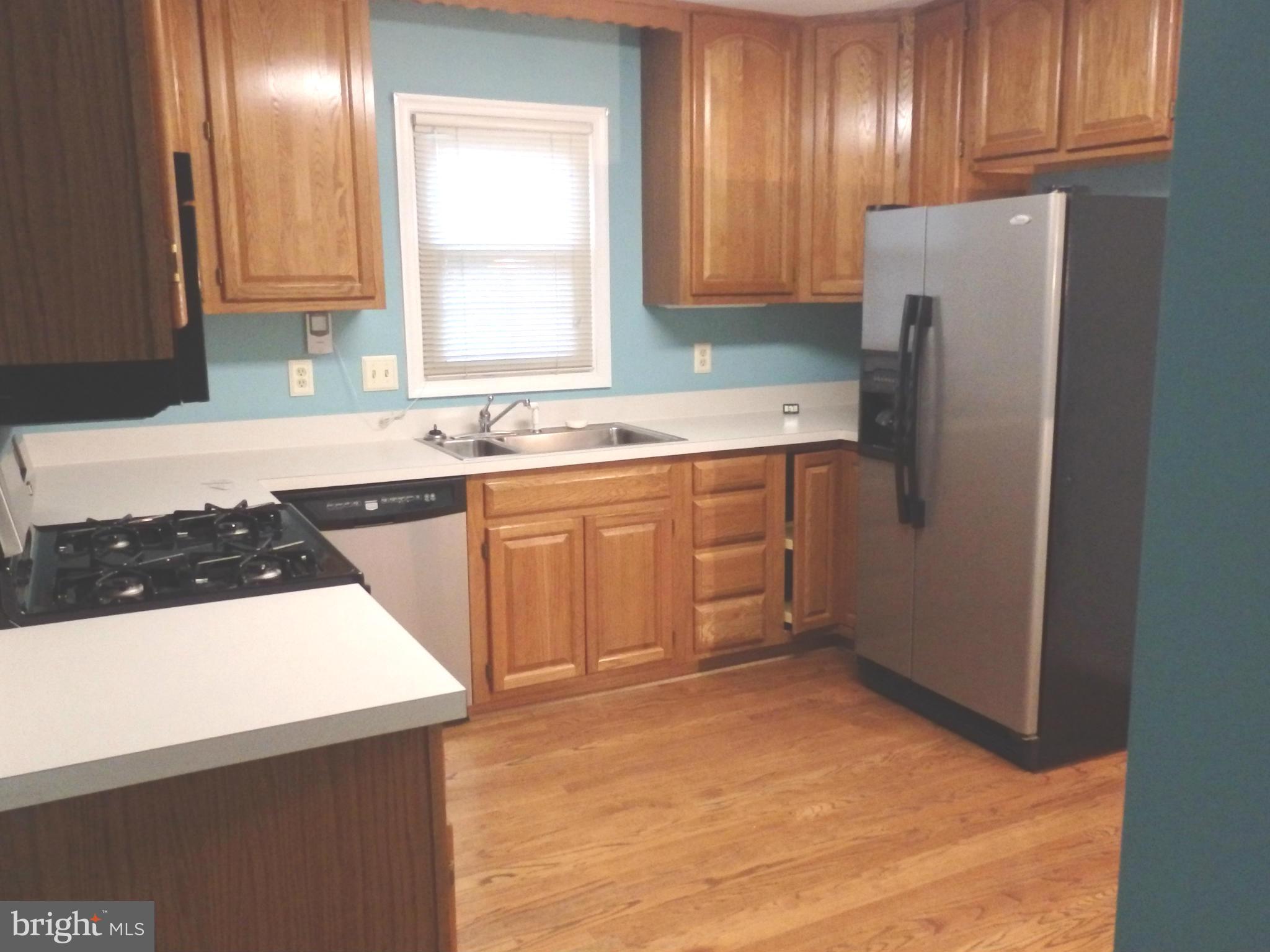 2419 Bear Den Road Frederick, MD 21701 - Photo 10 of 24 Kitchen with hardwood flooring and stainless