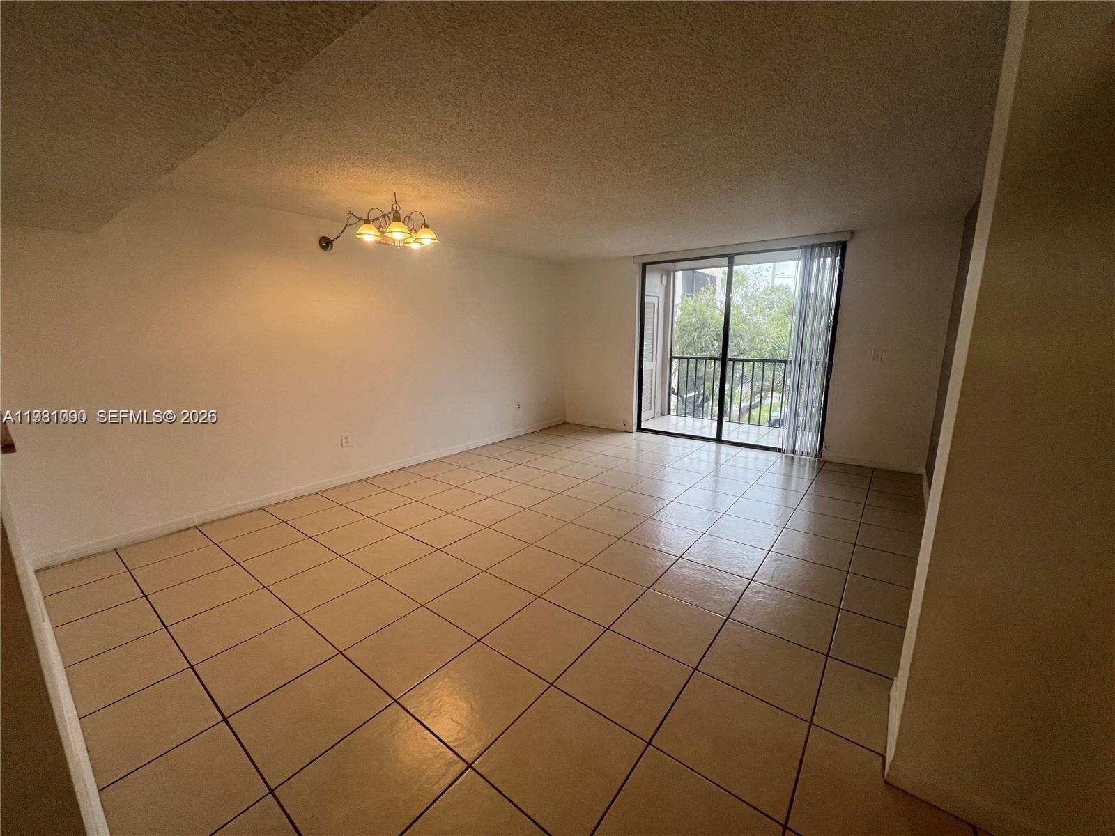 8500 Southwest 133rd Avenue Road, Unit 305 Miami, FL 33183 - Photo 2 of 7 a view of a livingroom and window