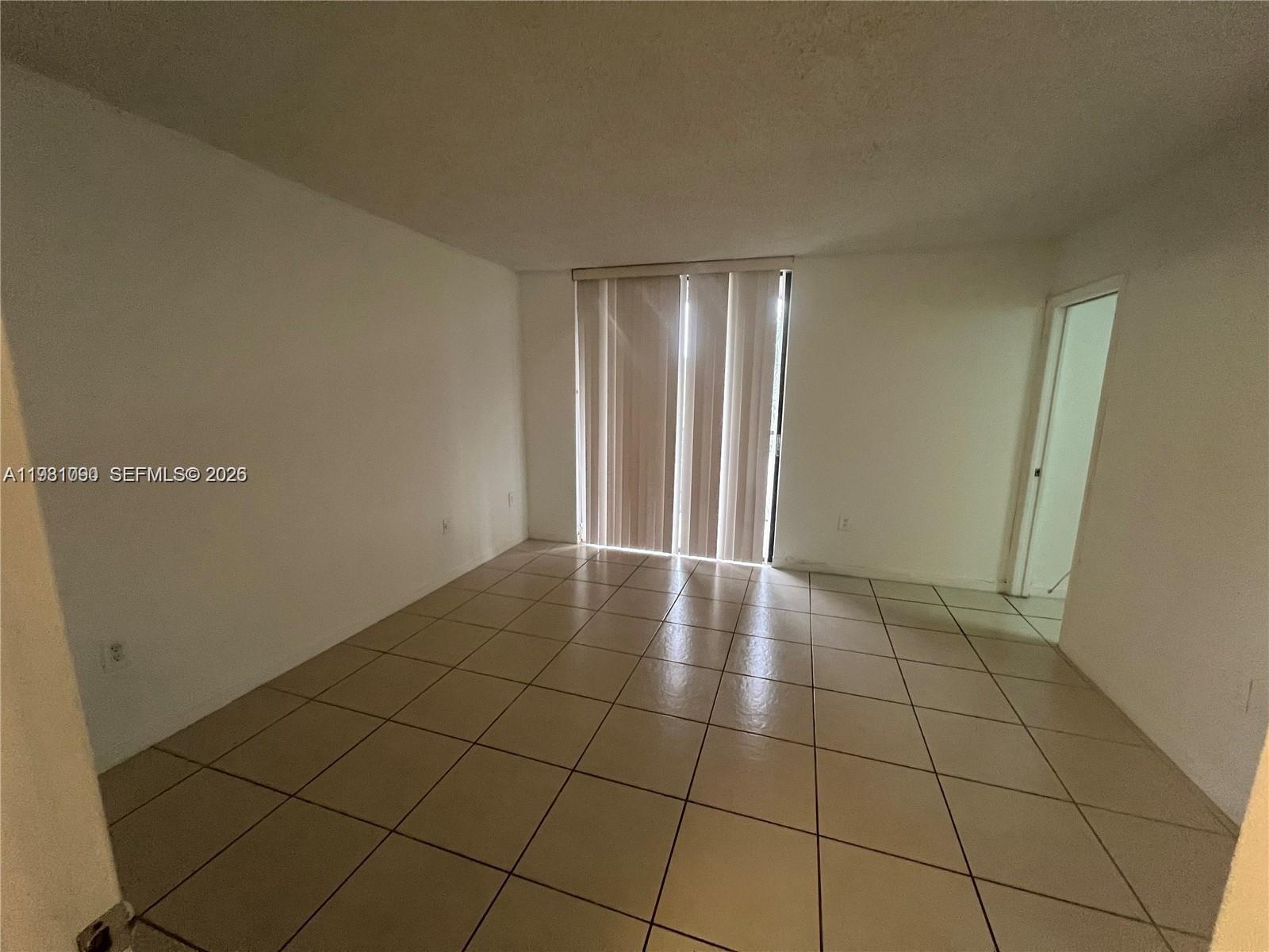 8500 Southwest 133rd Avenue Road, Unit 305 Miami, FL 33183 - Photo 7 of 7 a view of an empty room and window