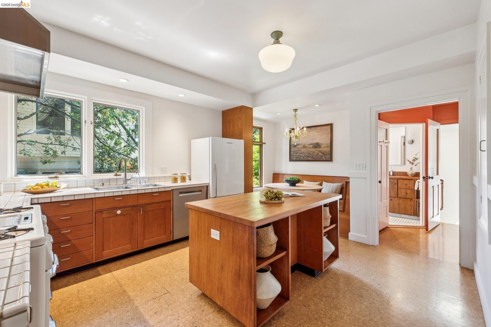 1490 Arch Street Berkeley, CA 94708 - Photo 17 of 57 a view of kitchen with stainless steel appliances granite countertop a stove and a refrigerator
