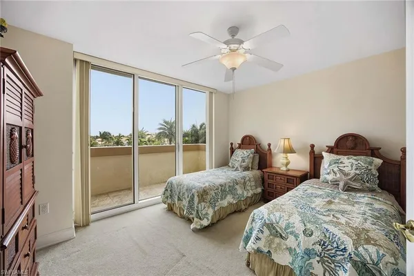 a bedroom with bed and a window