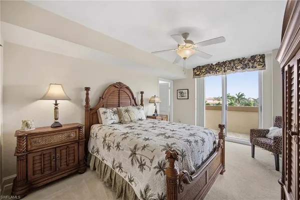 a bathroom with a granite countertop shower a sink and mirror
