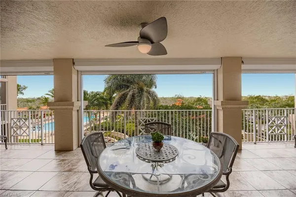 a very nice looking room with a large mirror and furniture