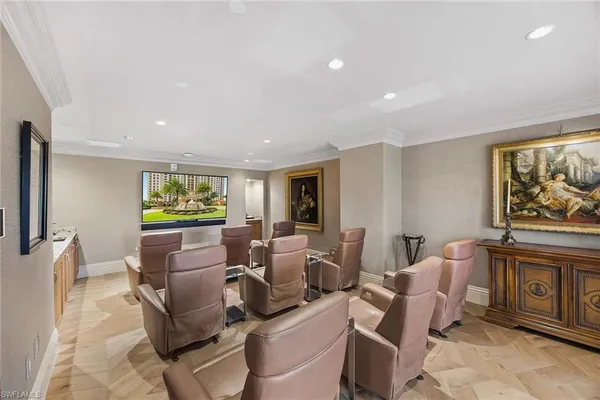 a view of a swimming pool with a table and chairs
