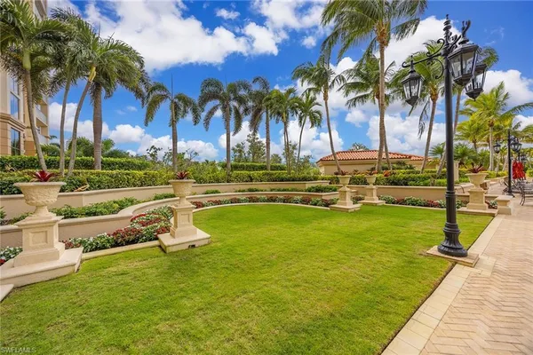 a view of a swimming pool with a lawn chairs