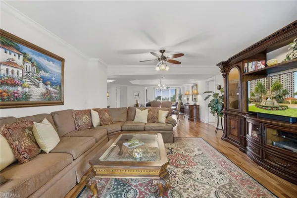 a kitchen with a stove sink and cabinets