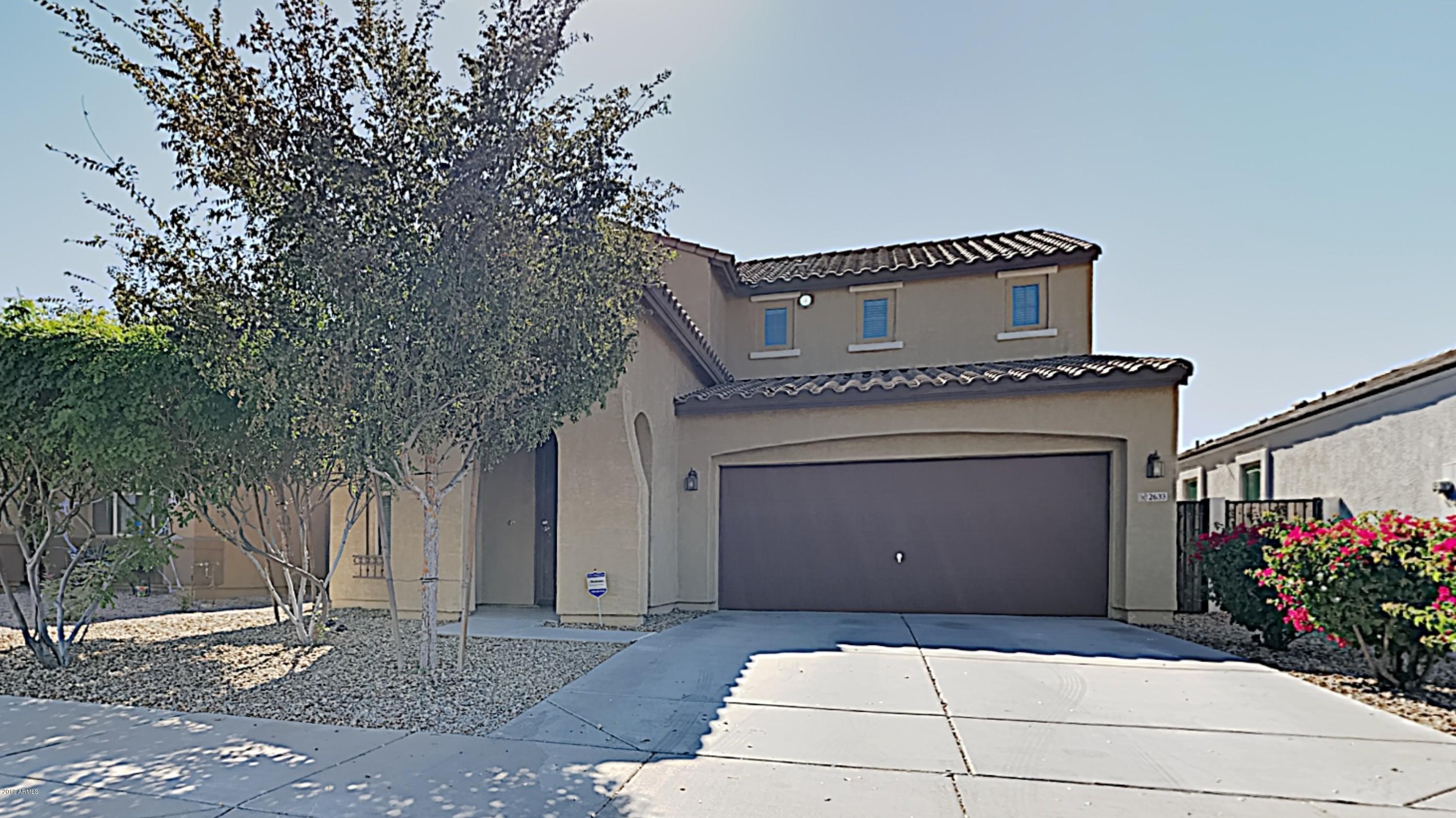 2633 West Gaby Road Phoenix, AZ 85041 - Photo 1 of 17 a front view of a house with a garage