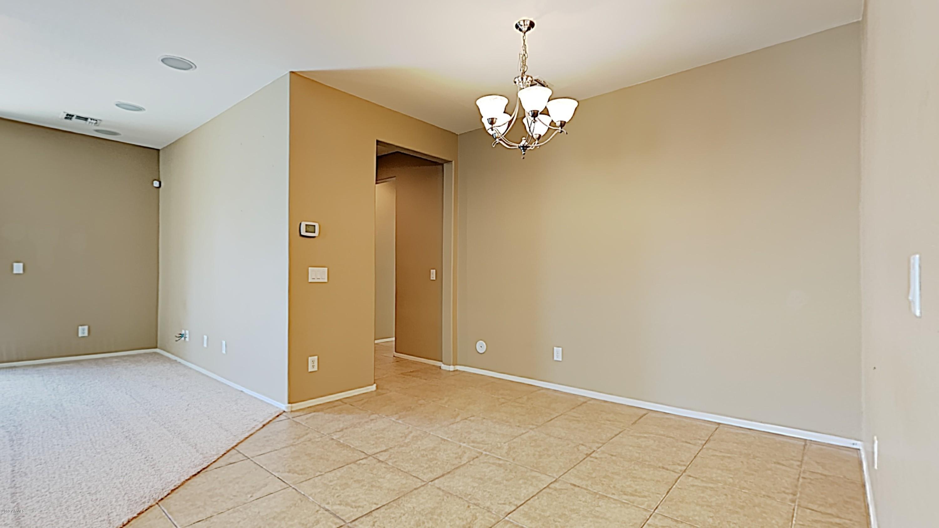 2633 West Gaby Road Phoenix, AZ 85041 - Photo 3 of 17 a view of livingroom with window